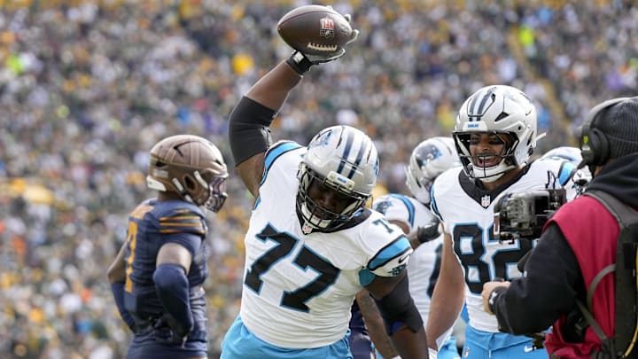 Nov 2, 2025; Green Bay, Wisconsin, USA; Carolina Panthers offensive tackle Yosh Nijman (77) celebrates after a Panthers touchdown during the first half against the Green Bay Packers at Lambeau Field. Mandatory Credit: Jeff Hanisch-Imagn Images