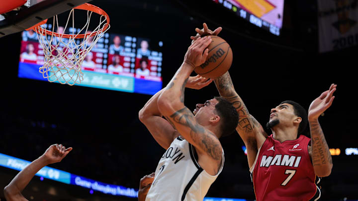 Mar 5, 2026; Miami, Florida, USA; Miami Heat center Kel'el Ware (7) blocks the shot of Brooklyn Nets forward Michael Porter Jr. (17) during the first quarter at Kaseya Center. Mandatory Credit: Sam Navarro-Imagn Images