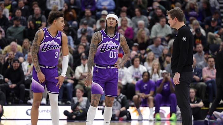 Jan 18, 2024; Salt Lake City, Utah, USA;  Utah Jazz guard Keyonte George (3) and guard Jordan Clarkson (00) and head coach Will Hardy talk during a stop in play during the second half against the Oklahoma City Thunder at Delta Center. Mandatory Credit: Chris Nicoll-Imagn Images