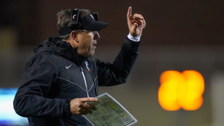Cincinnati Bearcats head coach Scott Satterfield attempts to call a play following a touchdown in the fourth quarter of the NCAA Big12 football game between the Oklahoma State Cowboys and the Cincinnati Bearcats at Boone Pickens Stadium in Stillwater, Okla., on Saturday, Oct. 28, 2023.