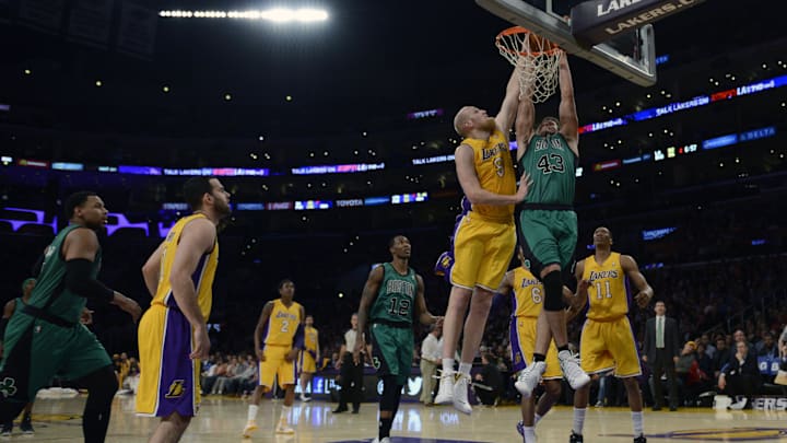 Feb 21, 2014; Los Angeles, CA, USA; Boston Celtics forward Kris Humphries (43) dunks the ball as Los Angeles Lakers center Chris Kaman (9) defends during the second quarter at Staples Center. Mandatory Credit: Kelvin Kuo-Imagn Images Feb 21, 2014; Los Angeles, CA, USA; Boston Celtics forward Kris Humphries (43) dunks the ball as Los Angeles Lakers center Chris Kaman (9) defends during the second quarter at Staples Center. Mandatory Credit: Kelvin Kuo-Imagn Images