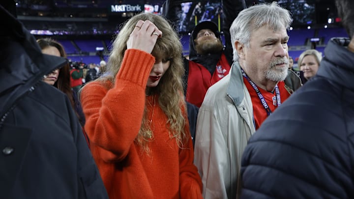 Jan 28, 2024; Baltimore, Maryland, USA; Singer/songwriter Taylor Swift (L) stands on the field after the game between the Kansas City Chiefs and Baltimore Ravens in the AFC Championship football game at M&T Bank Stadium. Mandatory Credit: Geoff Burke-Imagn Images