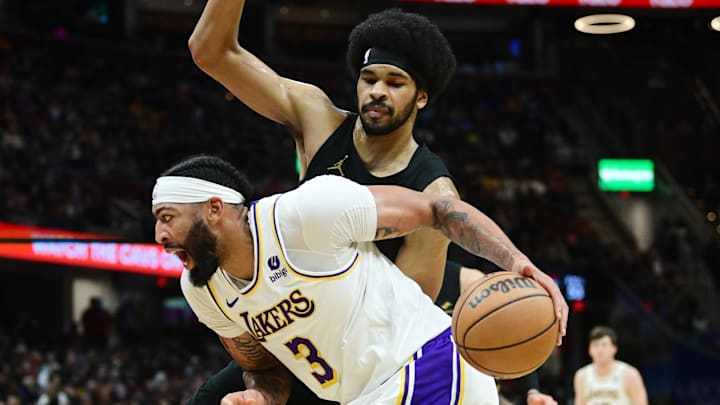 Nov 25, 2023; Cleveland, Ohio, USA; Cleveland Cavaliers guard Caris LeVert (3) drives to the basket against Cleveland Cavaliers center Jarrett Allen (31) during the second half at Rocket Mortgage FieldHouse. Mandatory Credit: Ken Blaze-Imagn Images