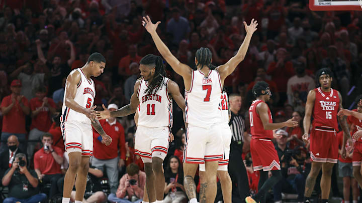 Jan 6, 2026; Houston, Texas, USA; Houston Cougars center Chris Cenac Jr. (5) and forward Joseph Tugler (11) react after a play during the first half against the Texas Tech Red Raiders at Fertitta Center. Mandatory Credit: Troy Taormina-Imagn Images