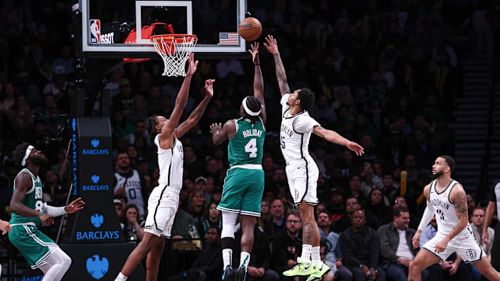 Nov 13, 2024; Brooklyn, New York, USA; Boston Celtics guard Jrue Holiday (4) shoots the ball asBrooklyn Nets guard Keon Johnson (45) and forward Noah Clowney (21) defend during the second half at Barclays Center. Mandatory Credit: Vincent Carchietta-Imagn Images Nov 13, 2024; Brooklyn, New York, USA; Boston Celtics guard Jrue Holiday (4) shoots the ball asBrooklyn Nets guard Keon Johnson (45) and forward Noah Clowney (21) defend during the second half at Barclays Center. Mandatory Credit: Vincent Carchietta-Imagn Images
