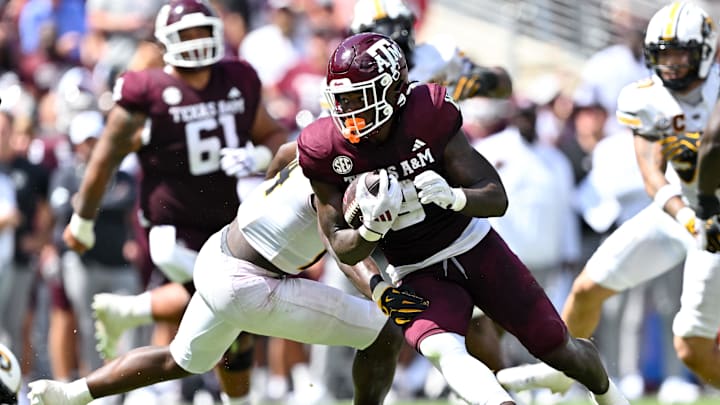 Oct 5, 2024; College Station, Texas, USA; Texas A&M Aggies running back Le'Veon Moss (8) carries the ball in the second half against the Missouri Tigers at Kyle Field. Mandatory Credit: Maria Lysaker-Imagn Images. 