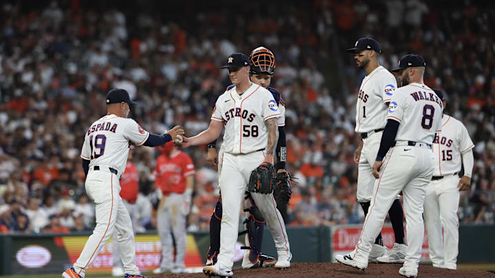 Mar 26, 2026; Houston, Texas, USA;  Houston Astros manager Joe Espada (19) pulls starting pitcher Hunter Brown (58) in the fi