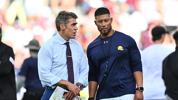 Aug 31, 2024; College Station, Texas, USA; Chris Fowler a broadcaster for ESPN, left, speaks with Notre Dame Fighting Irish head coach Marcus Freeman prior to the game against the Texas A&M Aggies at Kyle Field. Mandatory Credit: Maria Lysaker-Imagn Images Aug 31, 2024; College Station, Texas, USA; Chris Fowler a broadcaster for ESPN, left, speaks with Notre Dame Fighting Irish head coach Marcus Freeman prior to the game against the Texas A&M Aggies at Kyle Field. Mandatory Credit: Maria Lysaker-Imagn Images