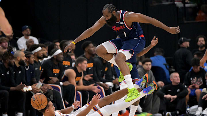 Oct 24, 2025; Inglewood, California, USA; Los Angeles Clippers guard James Harden (1) jumps over Phoenix Suns forward Oso Ighodaro (11) as he goes for a loose ball in the first half at Intuit Dome. Mandatory Credit: Jayne Kamin-Oncea-Imagn Images Oct 24, 2025; Inglewood, California, USA; Los Angeles Clippers guard James Harden (1) jumps over Phoenix Suns forward Oso Ighodaro (11) as he goes for a loose ball in the first half at Intuit Dome. Mandatory Credit: Jayne Kamin-Oncea-Imagn Images