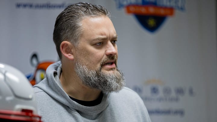 Brennan Carroll, Offensive Coordinator for the Washington football team, answers questions from the media during the coordinator news conference at the Hawthorn Suites in El Paso, Texas, on Saturday, Dec. 28, 2024.