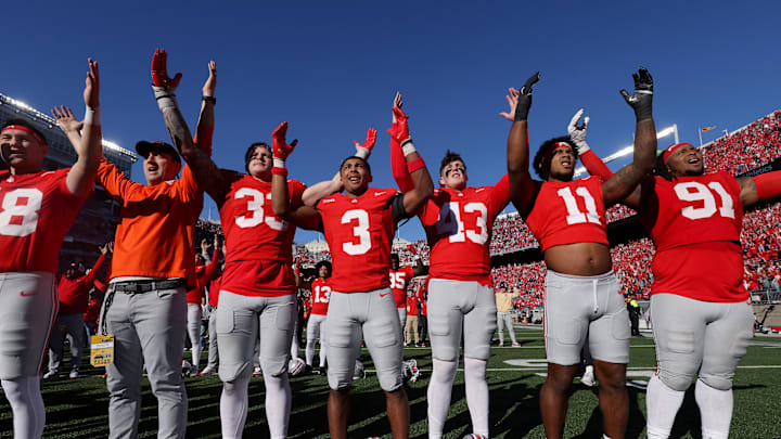 Oct 26, 2024; Columbus, Ohio, USA; Ohio State Buckeyes defensive end Jack Sawyer (33), cornerback Lorenzo Styles Jr. (3), long snapper John Ferlmann (43) and linebacker C.J. Hicks (11) celebrate following the win against the Nebraska Cornhuskers at Ohio Stadium. Mandatory Credit: Joseph Maiorana-Imagn Images
