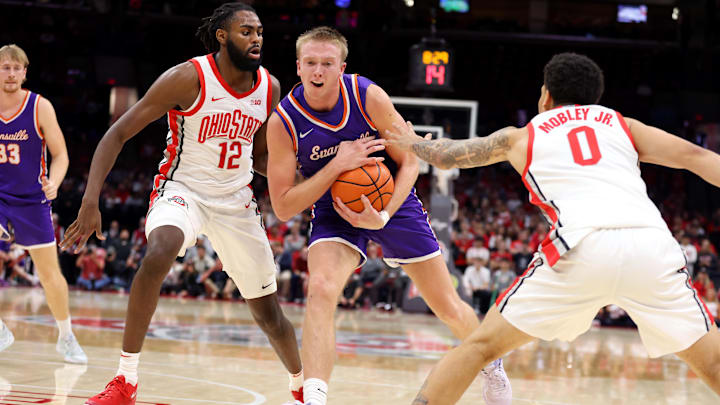 Nov 19, 2024; Columbus, Ohio, USA;  Evansville Aces guard Tanner Cuff (1) dribbles the ball as Ohio State Buckeyes guard Evan Mahaffey (12) defends during the first half at Value City Arena. Mandatory Credit: Joseph Maiorana-Imagn Images