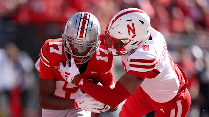 Oct 26, 2024; Columbus, Ohio, USA; Ohio State Buckeyes wide receiver Carnell Tate (17) catches a touchdown pass as Nebraska Cornhuskers defensive back DeShon Singleton (8) defends during the first quarter at Ohio Stadium. Mandatory Credit: Joseph Maiorana-Imagn Images Oct 26, 2024; Columbus, Ohio, USA; Ohio State Buckeyes wide receiver Carnell Tate (17) catches a touchdown pass as Nebraska Cornhuskers defensive back DeShon Singleton (8) defends during the first quarter at Ohio Stadium. Mandatory Credit: Joseph Maiorana-Imagn Images