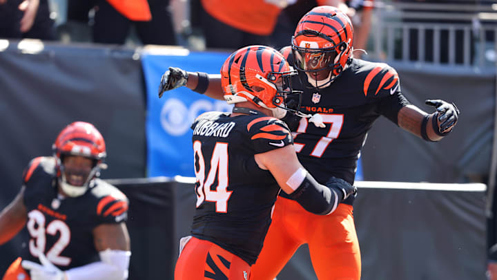 Oct 6, 2024; Cincinnati, Ohio, USA; Cincinnati Bengals defensive end Sam Hubbard (94) celebrates a safety with safety Jordan Battle (27) during the first half against the Baltimore Ravens at Paycor Stadium. Mandatory Credit: Joseph Maiorana-Imagn Images
