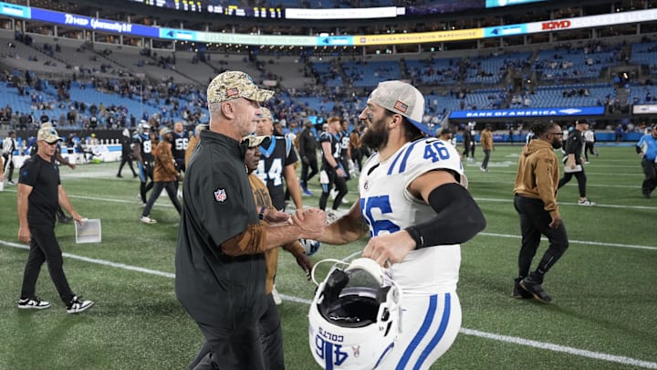 Nov 5, 2023; Charlotte, North Carolina, USA; Carolina Panthers head coach Frank Reich with Indianapolis Colts long snapper Luke Rhodes (46) after the game at Bank of America Stadium. Mandatory Credit: Bob Donnan-Imagn Images