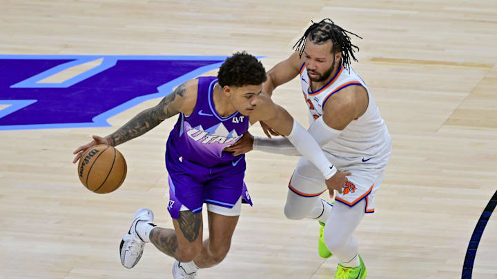 Utah Jazz guard Keyonte George dribbles the ball against New York Knicks guard Jalen Brunson. Mandatory Credit: Christopher Creveling-Imagn Images