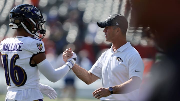 Oct 6, 2024; Cincinnati, Ohio, USA; Baltimore Ravens wide receiver Tylan Wallace (16) and Baltimore Ravens head coach John Harbaugh warm up before the game against the Cincinnati Bengals at Paycor Stadium. Mandatory Credit: Joseph Maiorana-Imagn Images