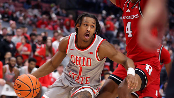 Dec 7, 2024; Columbus, Ohio, USA;  Ohio State Buckeyes guard Meechie Johnson Jr. (1) controls the ball as Rutgers Scarlet Knights guard Ace Bailey (4) defends during the second half at Value City Arena. Mandatory Credit: Joseph Maiorana-Imagn Images