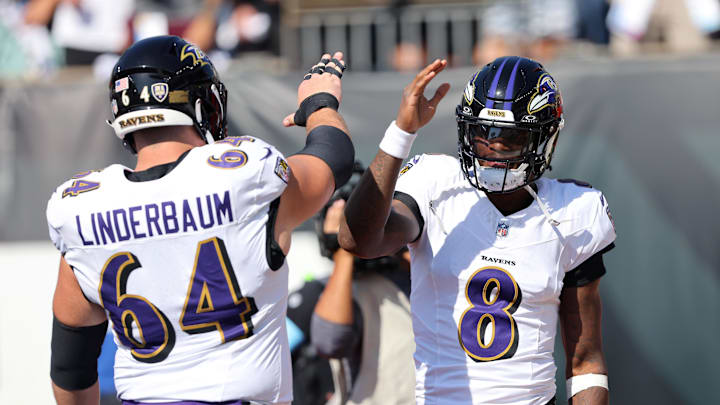 Oct 6, 2024; Cincinnati, Ohio, USA; Baltimore Ravens quarterback Lamar Jackson (8) and center Tyler Linderbaum (64) warm up before the game against the Cincinnati Bengals at Paycor Stadium. Mandatory Credit: Joseph Maiorana-Imagn Images