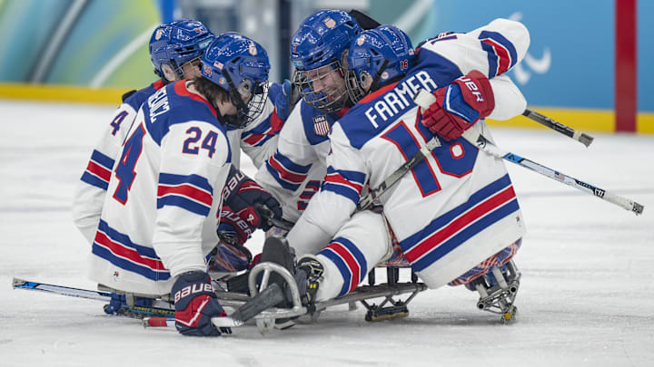 Mar 15, 2026; Milan, Italy; Jack Wallace USA celebrates with Declan Farmer USA and Joshua Misiewicz USA after scoring a goal in the Para Ice Hockey Gold Medal Game between United States of America and Canada during the Italy 2026 Paralympic Winter Games at Milano Santagiulia Ice Hockey Arena. Mandatory Credit: OIS/Matteo Colombo via Imagn Images