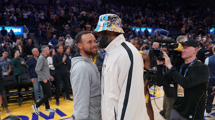 Oct 18, 2024; San Francisco, California, USA; Golden State Warriors guard Stephen Curry (30) meets with Los Angeles Lakers forward LeBron James (23) after the game at the Chase Center. Mandatory Credit: Cary Edmondson-Imagn Images
