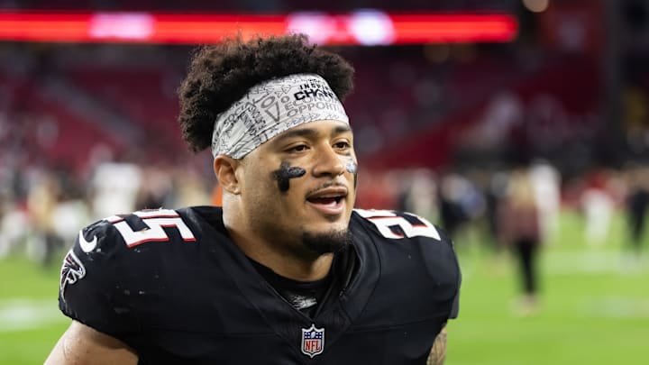 Dec 21, 2025; Glendale, Arizona, USA; Atlanta Falcons running back Tyler Allgeier (25) against the Arizona Cardinals at State Farm Stadium. Mandatory Credit: Mark J. Rebilas-Imagn Images