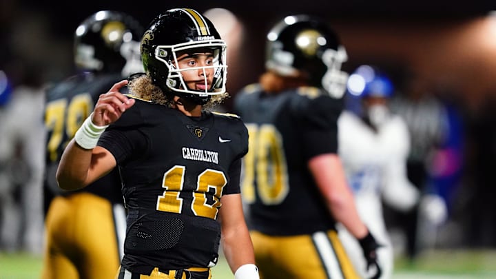 Oct 20, 2023; Carrollton, GA, USA; Carrollton Trojans quarterback Julian Lewis (10) looks for the