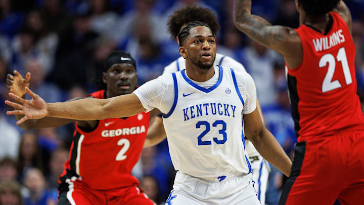 Feb 17, 2026; Lexington, Kentucky, USA; Kentucky Wildcats forward Mouhamed Dioubate (23) defends against Georgia Bulldogs forward Jake Wilkins (21) during the second half at Rupp Arena at Central Bank Center. Mandatory Credit: Jordan Prather-Imagn Images