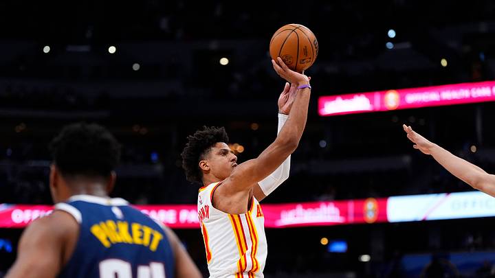 Jan 9, 2026; Denver, Colorado, USA; Atlanta Hawks forward Jalen Johnson (1) shoots the ball in the fourth quarter against the Denver Nuggets at Ball Arena. Mandatory Credit: Ron Chenoy-Imagn Images