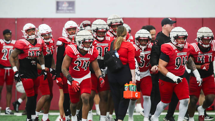 The Louisville defense takes to the field during practice on April 12, 2024 before the Red-White scrimmage game.