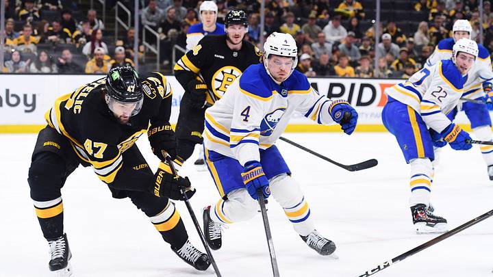Apr 26, 2026; Boston, Massachusetts, USA; Boston Bruins center Mark Kastelic (47) controls the puck while Buffalo Sabres defenseman Bowen Byram (4) defends during the third period in game four of the first round of the 2026 Stanley Cup Playoffs at TD Garden. Mandatory Credit: Bob DeChiara-Imagn Images