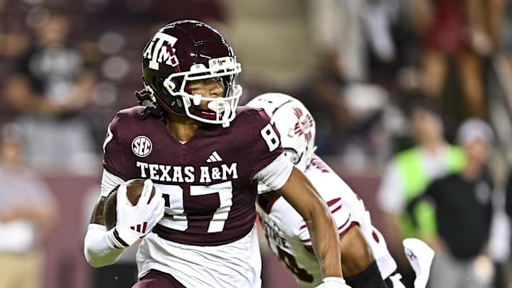 Nov 16, 2024; College Station, Texas, USA; Texas A&M Aggies wide receiver Ashton Bethel-Roman (87) runs the ball during the second half against the New Mexico State Aggies at Kyle Field. Mandatory Credit: Maria Lysaker-Imagn Images 