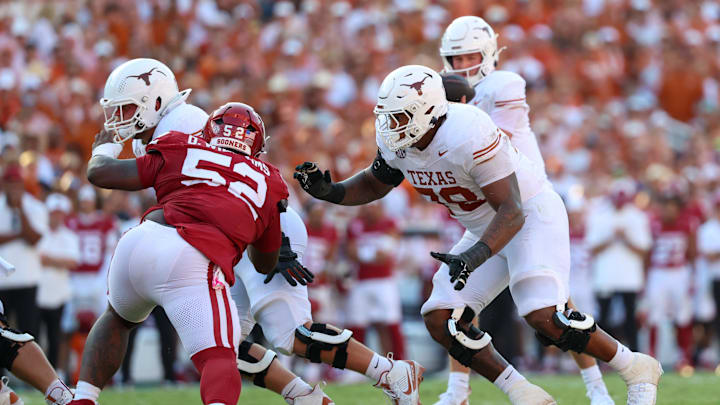 Oct 12, 2024; Dallas, Texas, USA; Texas Longhorns offensive lineman Kelvin Banks Jr. (78) looks to block Oklahoma Sooners defensive lineman Damonic Williams (52) during the game at the Cotton Bowl. Mandatory Credit: Kevin Jairaj-Imagn Images Oct 12, 2024; Dallas, Texas, USA; Texas Longhorns offensive lineman Kelvin Banks Jr. (78) looks to block Oklahoma Sooners defensive lineman Damonic Williams (52) during the game at the Cotton Bowl. Mandatory Credit: Kevin Jairaj-Imagn Images