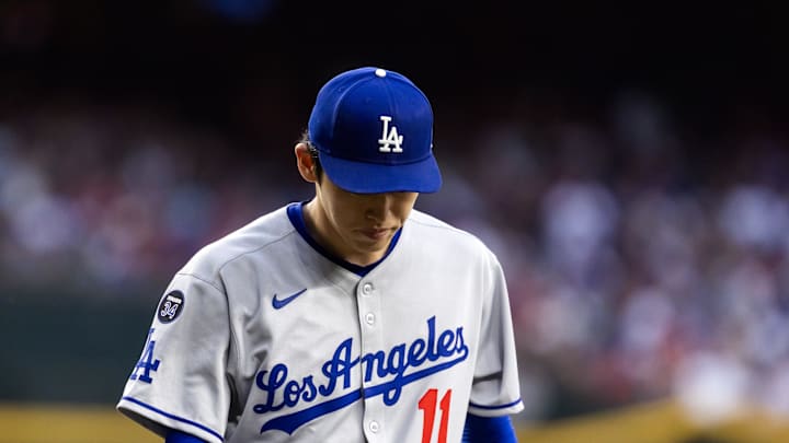 May 9, 2025; Phoenix, Arizona, USA; Los Angeles Dodgers pitcher Roki Sasaki (11) reacts against the Arizona Diamondbacks at Chase Field. Mandatory Credit: Mark J. Rebilas-Imagn Images