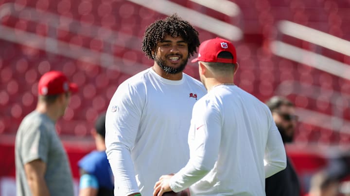 Dec 8, 2024; Tampa, Florida, USA; Tampa Bay Buccaneers offensive tackle Tristan Wirfs (78) and quarterback Baker Mayfield (6) warms up before a game against the Las Vegas Raiders at Raymond James Stadium. Mandatory Credit: Nathan Ray Seebeck-Imagn Images