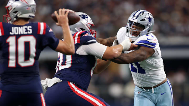 Dallas Cowboys linebacker Micah Parsons rushes the passer and is blocked by New England Patriots center David Andrews