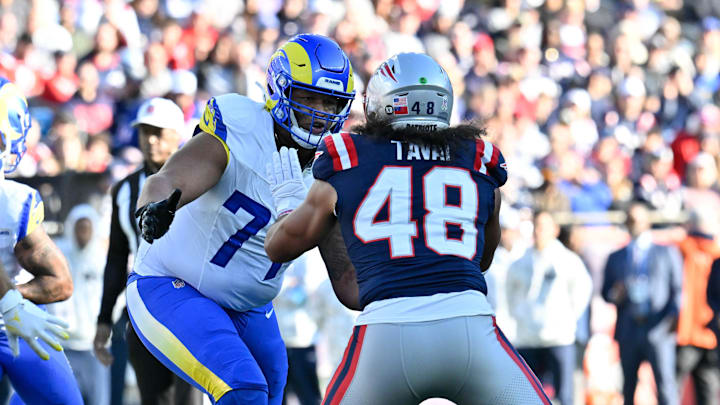 Nov 17, 2024; Foxborough, Massachusetts, USA; Los Angeles Rams offensive tackle Alaric Jackson (77) blocks New England Patriots linebacker Jahlani Tavai (48) during the first half at Gillette Stadium. Mandatory Credit: Eric Canha-Imagn Images