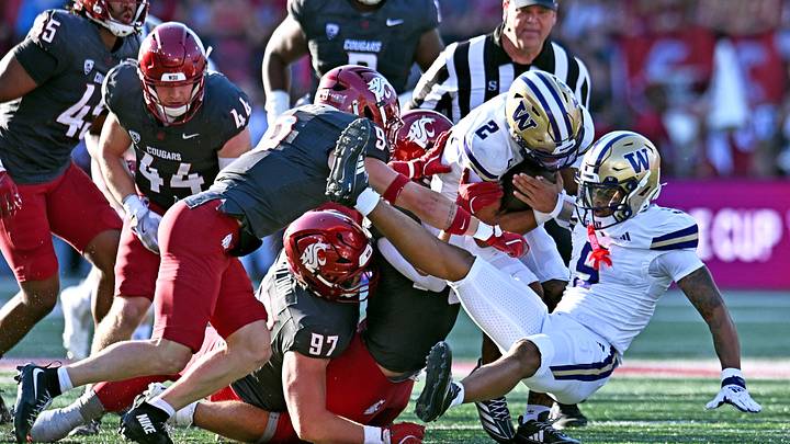 Sep 20, 2025; Pullman, Washington, USA; Washington Huskies quarterback Demond Williams Jr. (2) is stopped by Washington State Cougars linebacker Caleb Francl (9) and Washington State Cougars defensive tackle Max Baloun (97) in the first half of Apple Cup at Gesa Field at Martin Stadium.