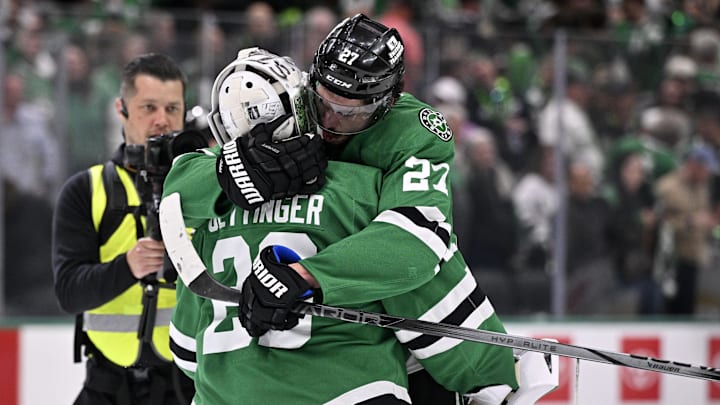 May 21, 2025; Dallas, Texas, USA; Dallas Stars goaltender Jake Oettinger (29) reacts with left wing Mason Marchment (27) after defeating the Edmonton Oilers in game one of the Western Conference Final of the 2025 Stanley Cup Playoffs at American Airlines Center. Mandatory Credit: Jerome Miron-Imagn Images