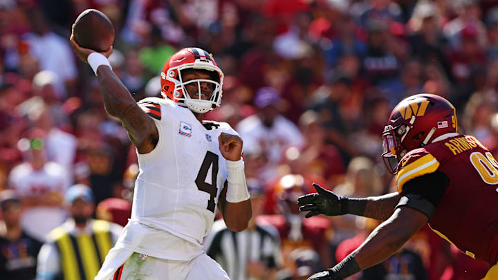 Oct 6, 2024; Landover, Maryland, USA; Cleveland Browns quarterback Deshaun Watson (4) throws a pass against Washington Commanders defensive end Dorance Armstrong (92) during the fourth quarter at NorthWest Stadium. Mandatory Credit: Peter Casey-Imagn Images