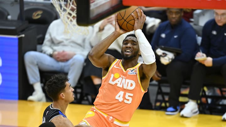 Jan 26, 2026; Cleveland, Ohio, USA; Cleveland Cavaliers guard Donovan Mitchell (45) shoots beside Orlando Magic forward Tristan da Silva (23) in the fourth quarter at Rocket Arena. Mandatory Credit: David Richard-Imagn Images