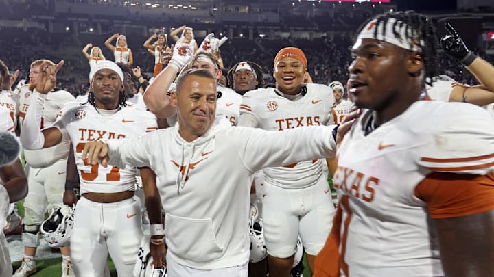 Texas Longhorns head coach Steve Sarkisian with defensive linemen Colin Simmons after beating the Mississippi State Bulldogs in overtime. Mandatory Credit: Petre Thomas-Imagn Images