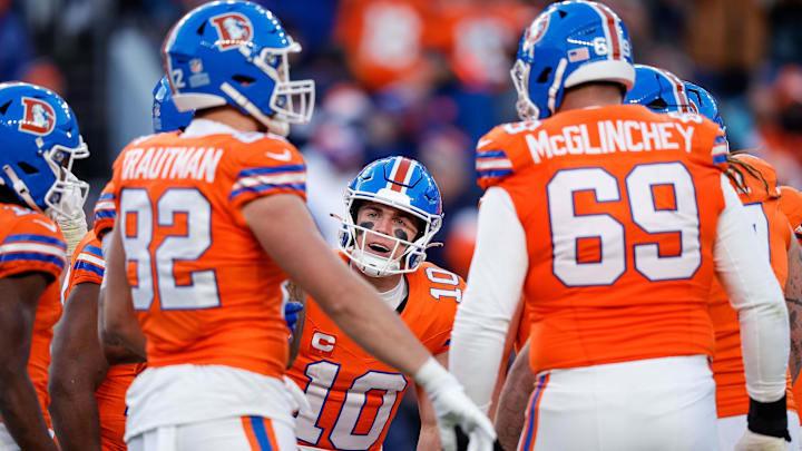 Jan 5, 2025; Denver, Colorado, USA; Denver Broncos quarterback Bo Nix (10) huddles with tight end Adam Trautman (82) and offensive tackle Mike McGlinchey (69) and teammates in the third quarter against the Kansas City Chiefs at Empower Field at Mile High. Jan 5, 2025; Denver, Colorado, USA; Denver Broncos quarterback Bo Nix (10) huddles with tight end Adam Trautman (82) and offensive tackle Mike McGlinchey (69) and teammates in the third quarter against the Kansas City Chiefs at Empower Field at Mile High.