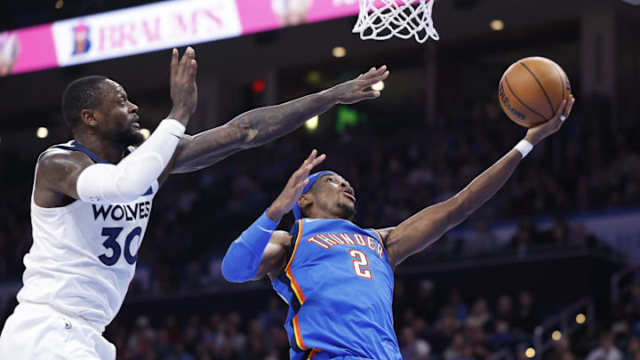 Dec 31, 2024; Oklahoma City, Oklahoma, USA; Oklahoma City Thunder guard Shai Gilgeous-Alexander (2) goes to the basket beside Minnesota Timberwolves forward Julius Randle (30) during the second half at Paycom Center. Mandatory Credit: Alonzo Adams-Imagn Images Dec 31, 2024; Oklahoma City, Oklahoma, USA; Oklahoma City Thunder guard Shai Gilgeous-Alexander (2) goes to the basket beside Minnesota Timberwolves forward Julius Randle (30) during the second half at Paycom Center. Mandatory Credit: Alonzo Adams-Imagn Images