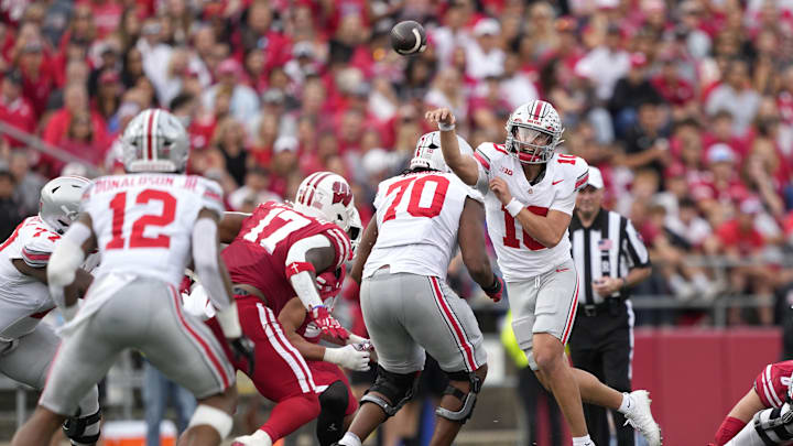 Oct 18, 2025; Madison, Wisconsin, USA;  Ohio State Buckeyes quarterback Julian Sayin (10) passes against the Wisconsin Badgers in the second half at Camp Randall Stadium. Mandatory Credit: Jeff Hanisch-Imagn Images Oct 18, 2025; Madison, Wisconsin, USA;  Ohio State Buckeyes quarterback Julian Sayin (10) passes against the Wisconsin Badgers in the second half at Camp Randall Stadium. Mandatory Credit: Jeff Hanisch-Imagn Images