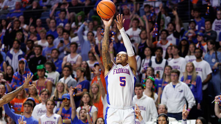 Mar 8, 2025; Gainesville, Florida, USA; Florida Gators guard Will Richard (5) shoots a three point basket against the Mississippi Rebels during the second half at Exactech Arena at the Stephen C. O'Connell Center. Mandatory Credit: Matt Pendleton-Imagn Images