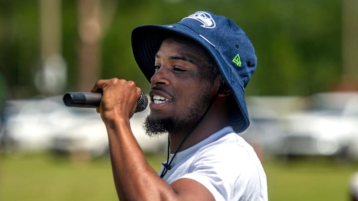 Seattle Seahawks cornerback and Pensacola native Devon Witherspoon speaks with young athletes during the Martin Emerson Jr. Free Youth Football Camp at Pine Forest High School Saturday, July 6, 2024.