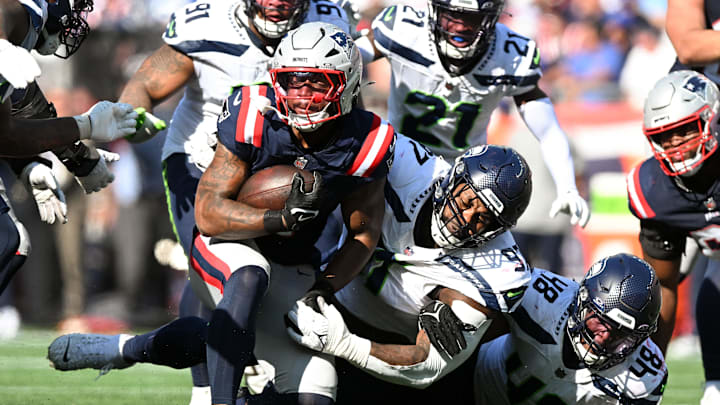 Sep 15, 2024; Foxborough, Massachusetts, USA; Seattle Seahawks defensive tackle Johnathan Hankins (97) tackles New England Patriots running back Antonio Gibson (4) during the second half at Gillette Stadium. Mandatory Credit: Brian Fluharty-Imagn Images Sep 15, 2024; Foxborough, Massachusetts, USA; Seattle Seahawks defensive tackle Johnathan Hankins (97) tackles New England Patriots running back Antonio Gibson (4) during the second half at Gillette Stadium. Mandatory Credit: Brian Fluharty-Imagn Images