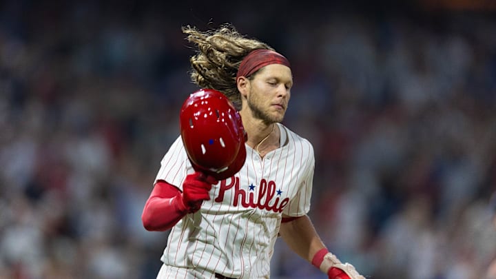 Jul 30, 2024; Philadelphia, Pennsylvania, USA; Philadelphia Phillies third base Alec Bohm (28) throws his helmet after lining out to end the eleventh inning against the New York Yankees at Citizens Bank Park. Mandatory Credit: Bill Streicher-Imagn Images