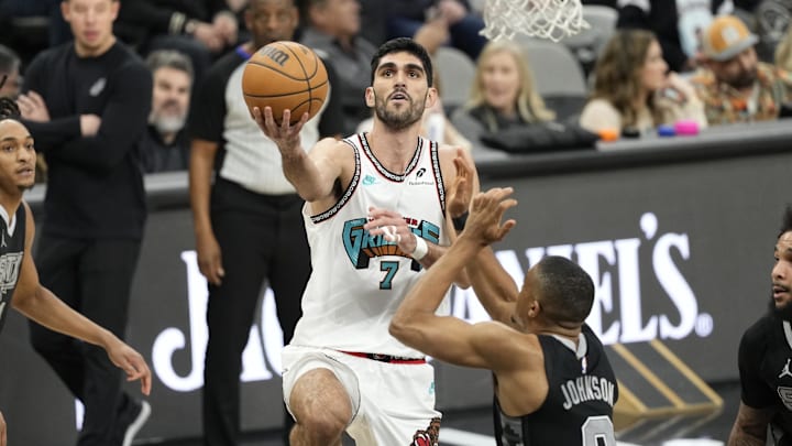 Jan 15, 2025; San Antonio, Texas, USA; mg Memphis Grizzlies forward Santi Aldama (7) drives to the basket against San Antonio Spurs forward Keldon Johnson (0) during the first half at Frost Bank Center. Mandatory Credit: Scott Wachter-Imagn Images